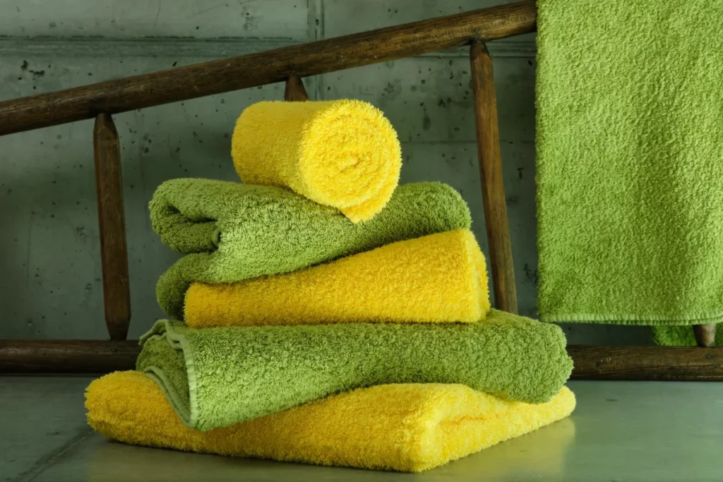 Yellow and green stacked towels from Hydeaway Shop
